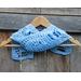 Another pic of a blue scarf with Easter eggs along its length.