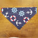 Over the collar dog bandana that is reversible from anchors to red with white polka dots, Anchor side