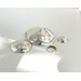 Backside of three nesting trinket dishes made from a vintage silverplated brass serving tray. Largest dish is a bird shape, two smaller dishes are round. Photo shows the backs of all three, my I Love You ring is shown for size comparison only