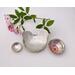 Set of three nesting trinket dishes made from a vintage silverplated brass serving tray. Largest dish is a bird shape, two smaller dishes are round. Photo shows all three side by side, one with tiny rose blossom floating in water.