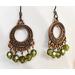 Copper hoop earrings with peridot crystals