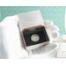 photo shows my gloved hand holding a silver trinket box which is open and showing a dime inside
