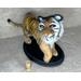 Tiger's size compared to a wine cork