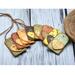 decoupage Wood gift tags with wooden hearts that are covered in vintage ephemera paper