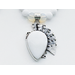 A close-up of the necklace's pendant, a reverse-teardrop shaped White Opal gemstone set in Silver.