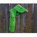 Another pic of a green scarf with tulips along its length.