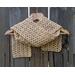 A tan shell crochet scarf display.
