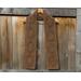 Display of the Diamond Crochet Scarf Pattern on a hanger in front of a wooden fence.