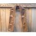 Display of the Dad Crochet Scarf on a hanger in front of a wooden fencer.