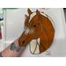 Quarter Horse in Palomino, shown being held for size reference.