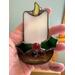 Close up of Candle stained glass ornament.