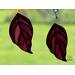 Dogwood stained glass ornaments in direct sunlight.