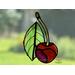 Cherry stained glass ornament in direct sunlight.