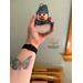 Snowman Ornament being held for size reference.