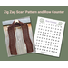 Display of the Zig Zag Crochet Scarf on a hanger in front of a wooden fence and a printable row counter.