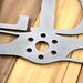 Close up of pilot family name metal sign with propeller, in raw steel.