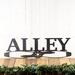 Aviator pilot family name metal sign with propeller, in silver vein powder coat.