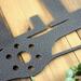 Close up of pilot family name metal sign with propeller, in silver vein powder coat.