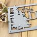 Close up of raw steel on our rectangular family name sign.
