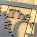 Close up of silver vein powder coat on our rectangular family name sign.