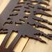 Close up of copper vein powder coat on our custom family name sign.