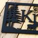 Close up of matte black powder coat on our personalized family name sign.