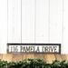 Rectangular metal hanging address sign, in raw steel.