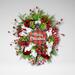 Festive Merry Christmas wreath featuring a plaid ornament centerpiece, vibrant red berries, white mesh ribbons, and lush greenery.