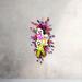 Bright and festive Halloween ghost wreath with purple, pink, and green accents. Handmade front door decoration for spooky Halloween fun.
