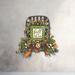 Farmhouse fall tobacco basket wreath with berries, greenery, and a 'Fall Is In The Air' sign. Perfect for rustic autumn wall decor.
