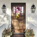 Colorful Halloween 'Boo' wreath with ghosts and vibrant accents, perfect for Halloween porch decor. Handmade and eye-catching design.
