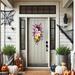 Unique ghost-themed Halloween wreath with glitter accents. 'Boo' sign centerpiece, perfect for Halloween porch and party decoration.