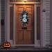 Halloween front porch decor with disco pumpkins. Handmade boho fall wreath with shimmering pumpkins and modern foliage for a trendy look.