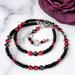 Black choker necklace with red hematite hearts.