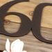 Close up of copper vein powder coat on our metal house number sign.