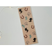 this western bookmark has a brown background with horseshoes, cacti, boots, & rope all over the book mark