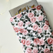 a medium size book is peeking out the floral book jacket