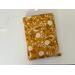 this mustard floral book sleeve has a mustard yellow background with dandelions all over the flower book cover