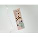 This scrapbook map bookmark has tan background with flowers, scrapbook map in the top left and bottom right corner and a map in the middle.