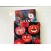 a small book peeking out of the pumpkin book jacket