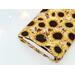 the inside of the padded book pouch matches the outside of the sunflower book cover