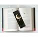 moon bookmark has a moon in the middle with beads and gold stars in the center with stars on the top and bottom