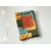 this fall kindle sleeve has fall color patchwork with different prints on each block