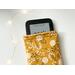 an ebook peeking out of the flower kindle sleeve