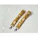 this floral keychain wristlet has mustard yellow background with dandelions all over the lanyard wristlet