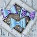 3 different lavender and purple bows. (Bows look blue in photos but are really lavender holographic.) Bows are sold individually.