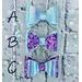 Bow choices: A) all lavender. B) Base lavender & top purple glitter. C) Base purple glitter & top lavender. Bows are approx. 2 1/2 x 1 1/2. 