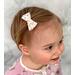 My 13 month old modeling a 2" numbers hair bow. Can also be purchased in 3", and sold as one bow, or two matching bows. 