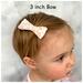 My 13 month old modeling a 3" size bow.