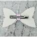 Back view of white glitter bow with pink & white ghost design, with very light pink lace ribbon. Bow is approx. 5 x 2 1/2.